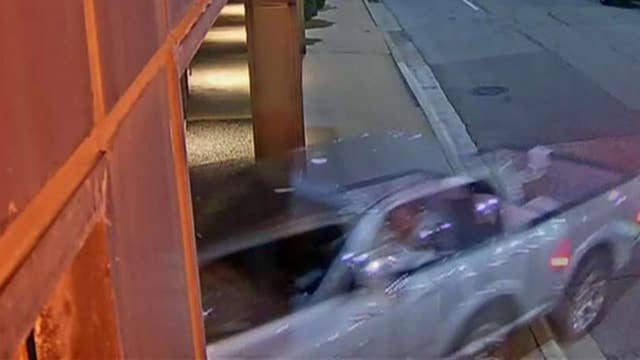 Surveillance video shows man driving into Dallas FOX station