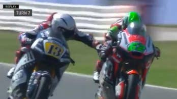 Motorcycle racer banned and fired after grabbing competitor's handbrake