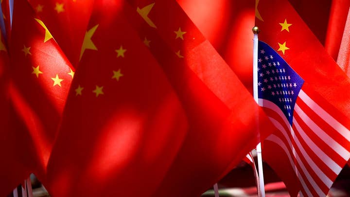 Trump threatens China with more import taxes