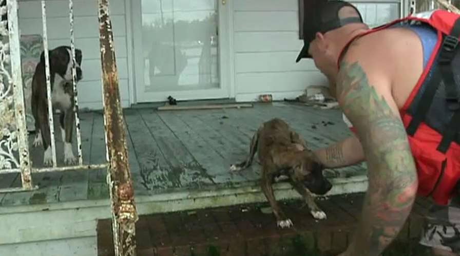 Rising floodwaters surround North Carolina communities