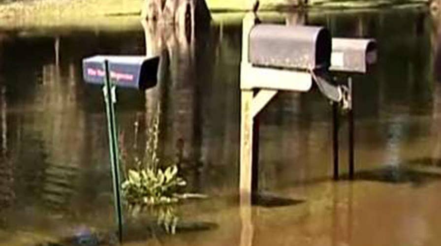 Cresting rivers threaten towns in North Carolina