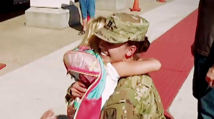 Army captain surprises daughters after year in Iraq