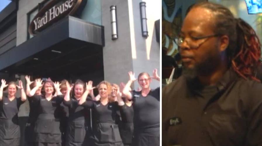 Restaurant staff sign happy birthday for deaf co-worker