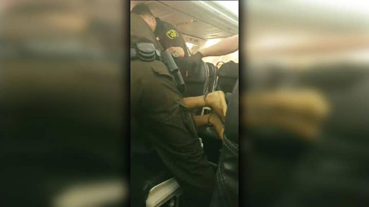 Disruptive airline passenger forcefully removed from plane