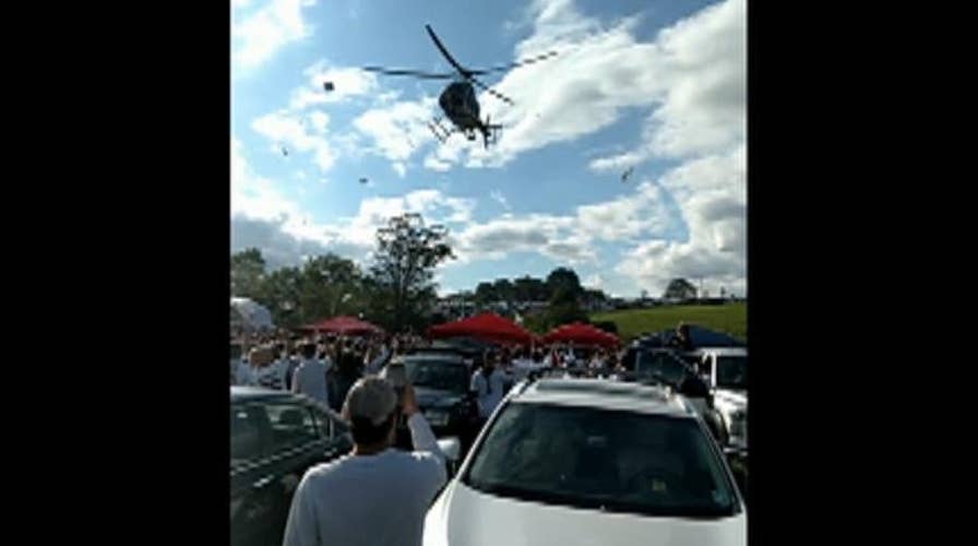 Police helicopter sends Penn State tailgate party flying