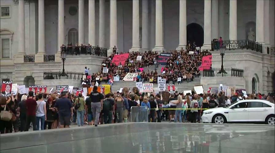 Activists gather on Capitol Hill to protest Brett Kavanaugh