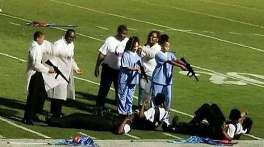 Marching band depicts murder of police officers at gunpoint