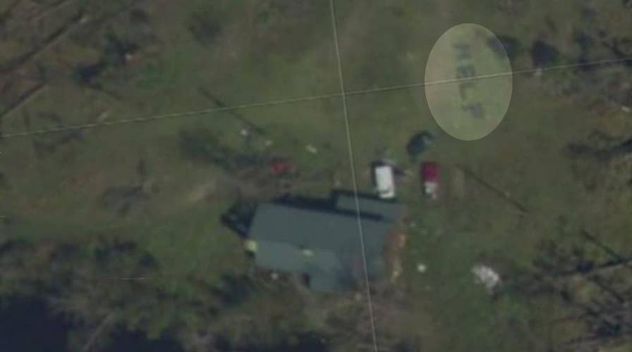 Michael victims rescued after spelling 'HELP' in yard