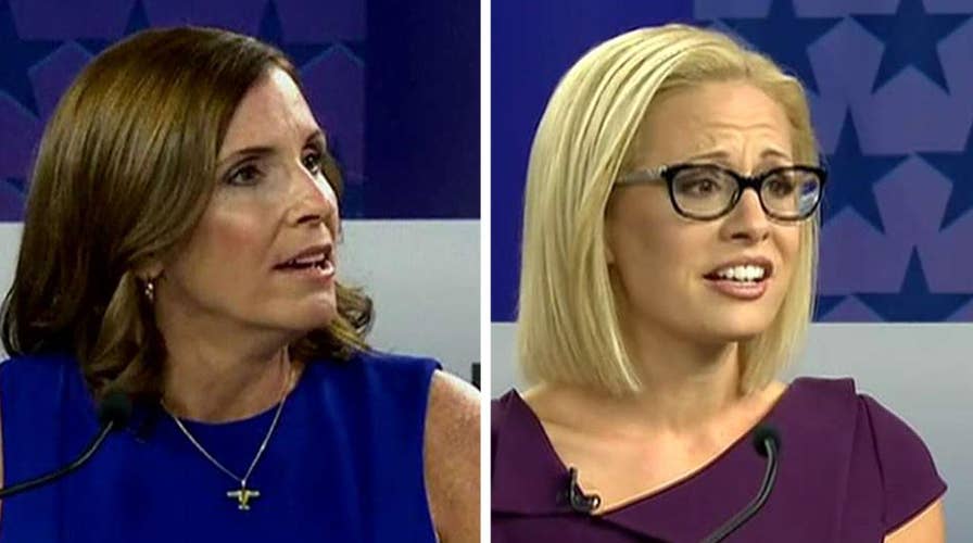 McSally accuses Sinema of supporting treason at fiery debate