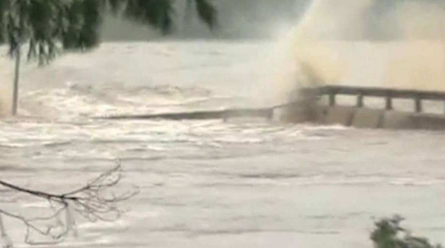 Floodwaters destroy a bridge over the Llano River in Texas