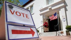 Russian national charged with interfering in US political system, 2018 elections