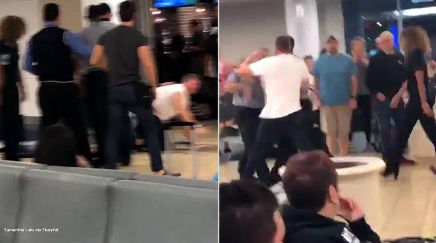 Intoxicated passenger filmed fighting with JetBlue staff, resisting police