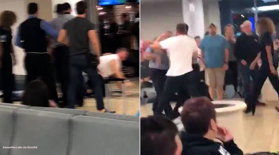 Intoxicated passenger filmed fighting with JetBlue staff, resisting police