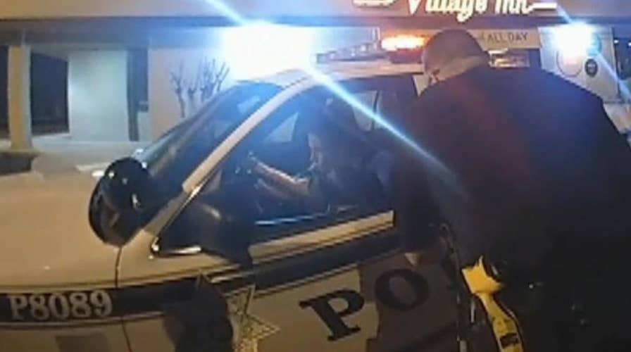 Handcuffed woman steals cop car in front of several officers