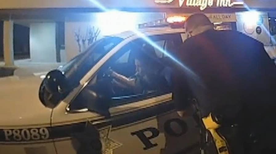 Handcuffed woman steals cop car in front of several officers