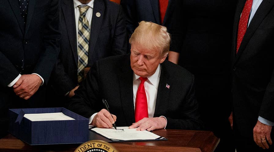 Trump signs bill to curb opioid epidemic