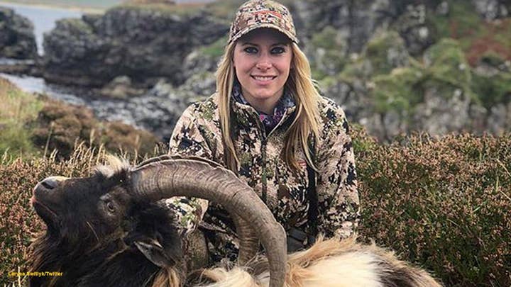 Host of 'Larysa Unleashed' gets slammed for posing with a dead goat