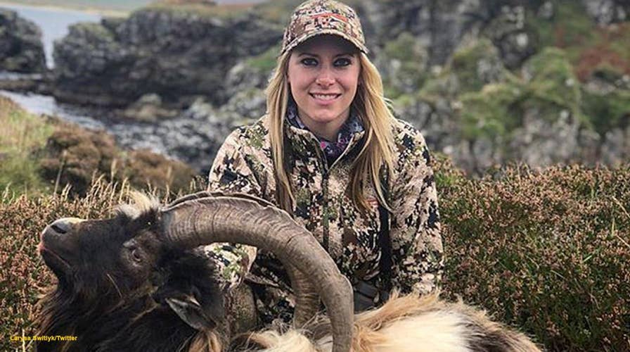 Host of 'Larysa Unleashed' gets slammed for posing with a dead goat