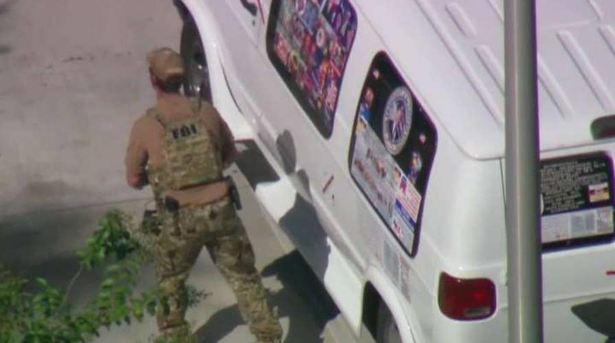 One suspect in custody in connection to suspicious packages