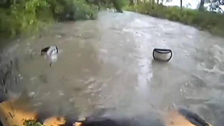 Texas bus attempts to drive through floodwaters