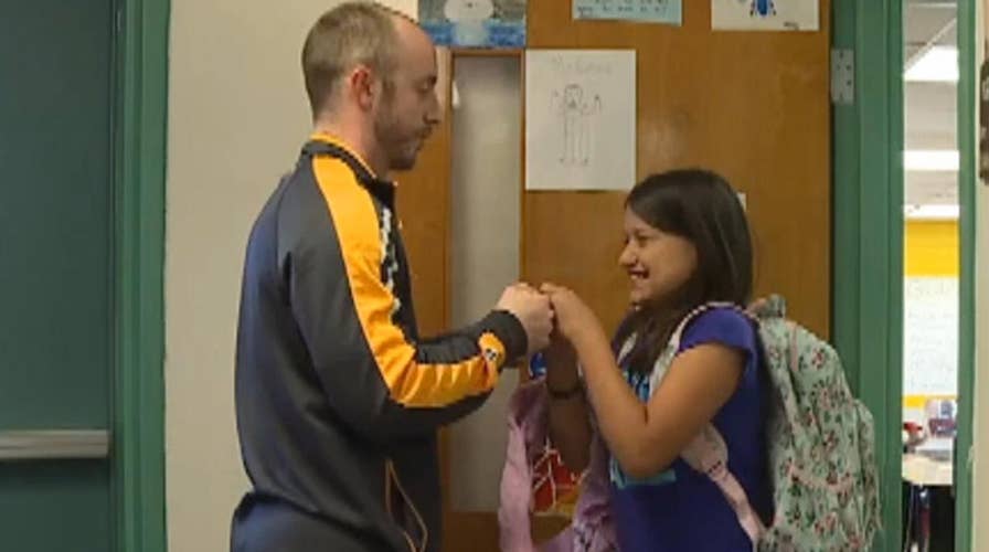 Teacher's unique handshakes go viral