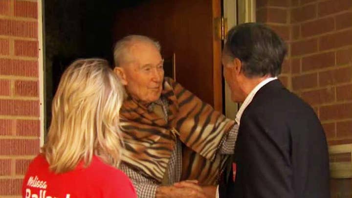 Mitt Romney goes door-to-door as he canvasses Salt Lake City