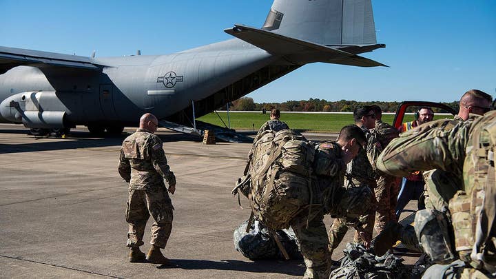 Trump says up to 15,000 troops may be sent to the border