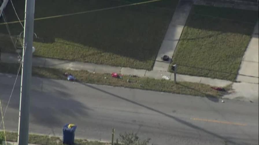 Backpacks seen strewn along street after car hit pedestrians