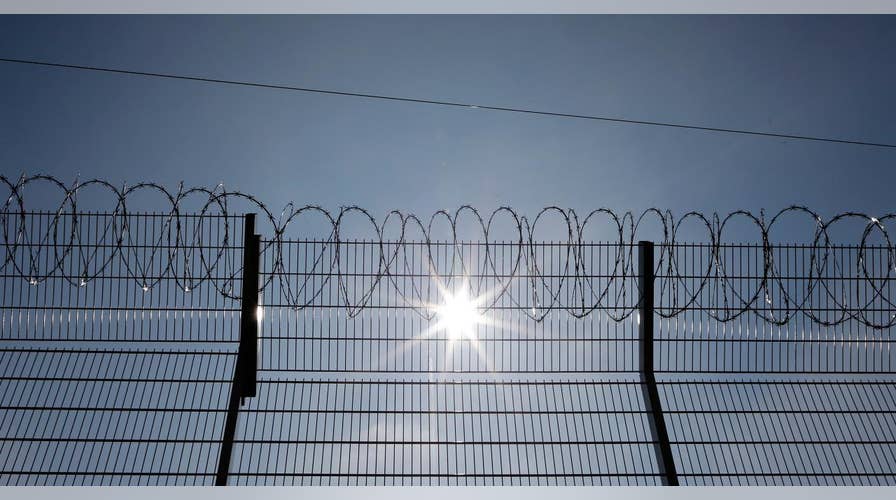 US troops put up barbed wire near Mexico border