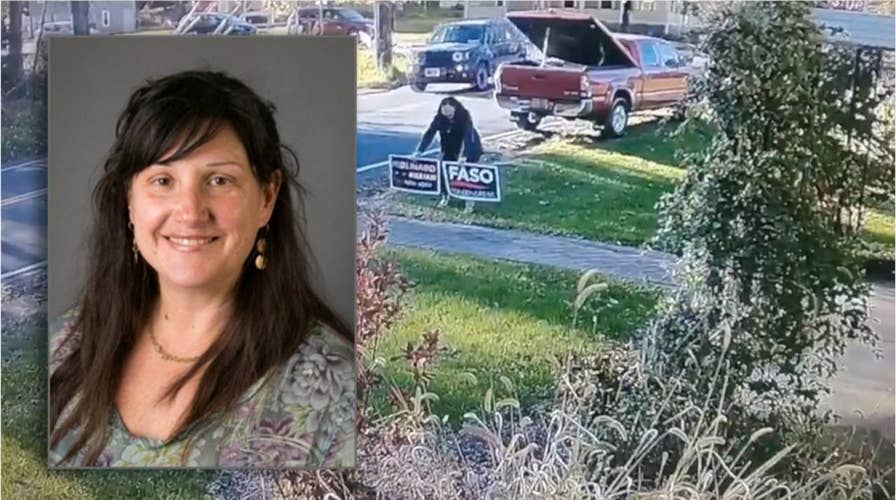 Professor caught on camera stealing Republican yard signs