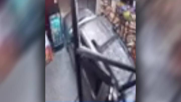 Car crashes through liquor store entrance, injuring customer