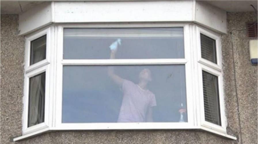 UK police share photo of woman cleaning window with warning