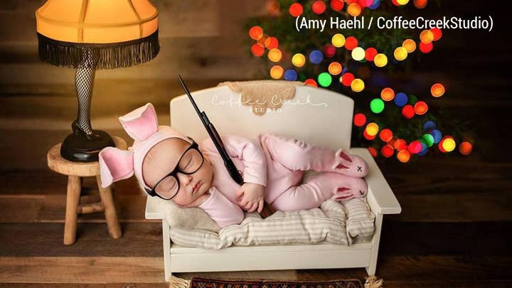 Photo of baby with a replica gun ignites debate