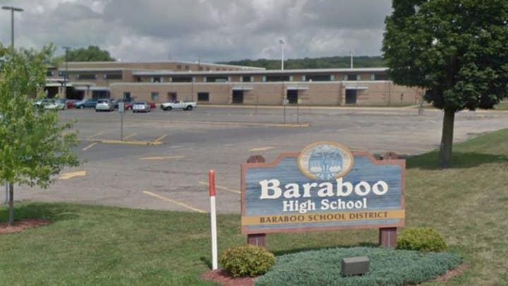 High school boys photographed giving Nazi salute