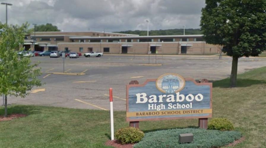 High school boys photographed giving Nazi salute