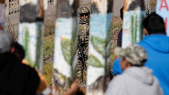 New focus on wall funding as migrants reach US border