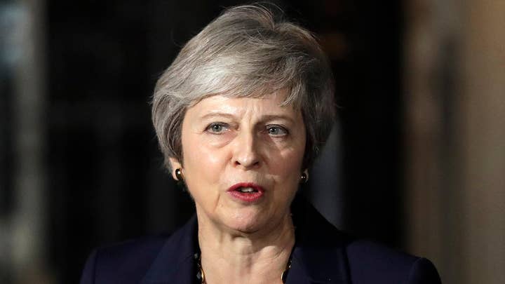 May's Brexit plan prompts backlash and resignations