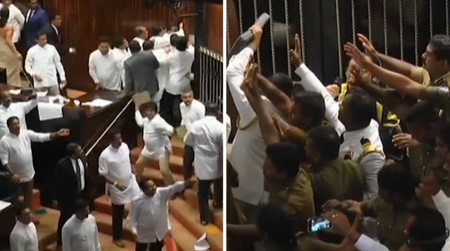 Pandemonium as books, chairs fly in Sri Lankan parliament
