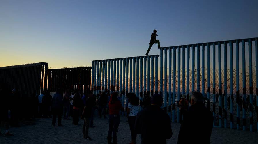 Tensions high at border as caravan arrives