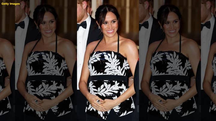 Duchess Meghan shows off baby bump at London fundraiser