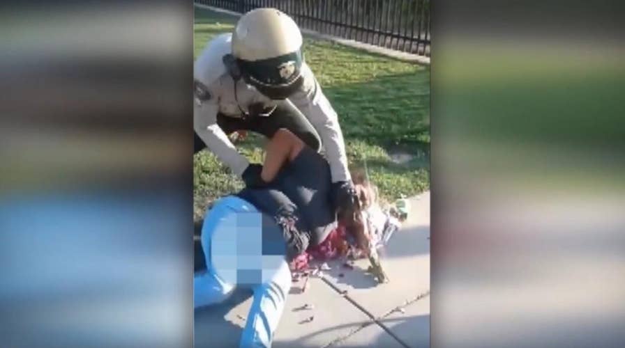 Violent arrest of woman selling flowers caught on camera