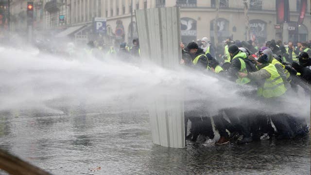 Tear gas, water cannons used in France fuel protests