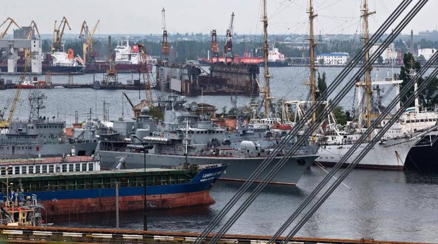 Russian military open fire, seize Ukrainian naval vessels