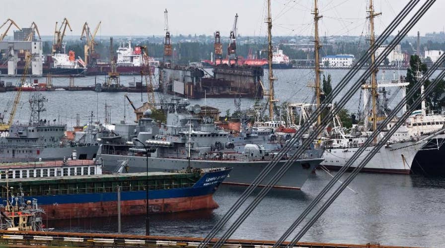 Russian military open fire, seize Ukrainian naval vessels