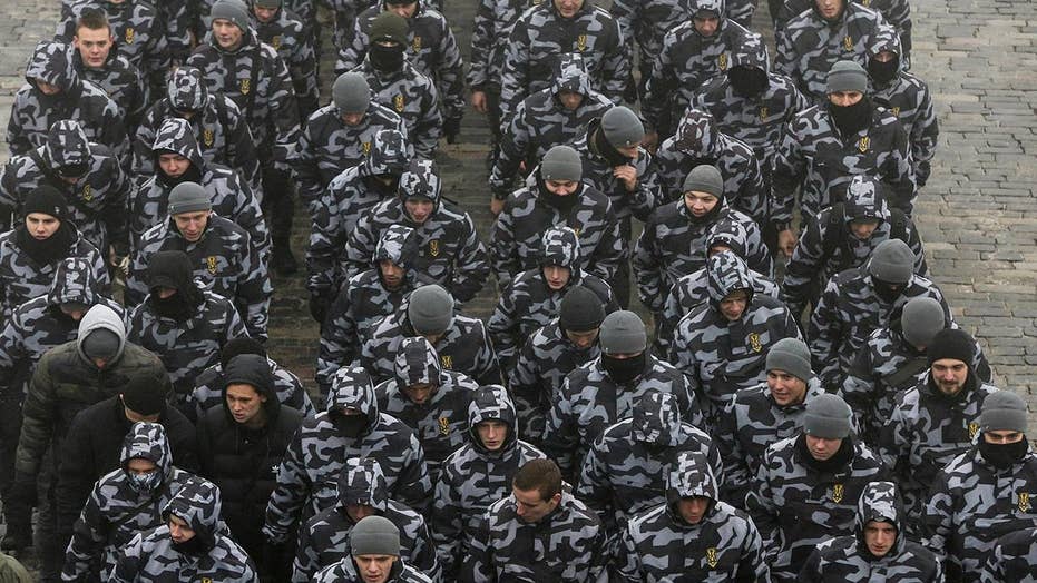Ukraine imposes martial law amid 'extremely serious' threat of Russian