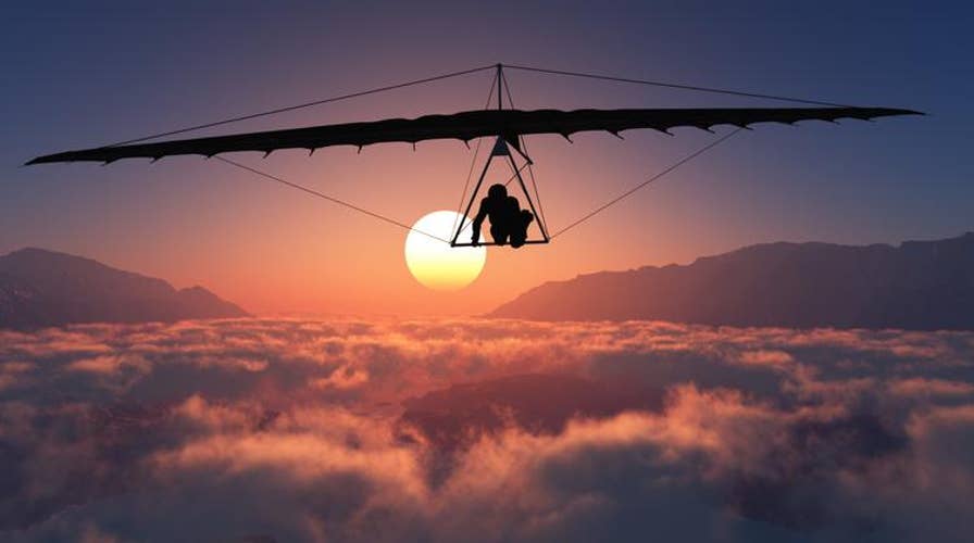 Hang-glider forced to hold on for his life