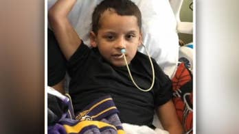 Boy, 8, wakes from coma after fall from cliff