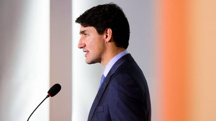 Trudeau takes aim at tariffs during USMCA signing