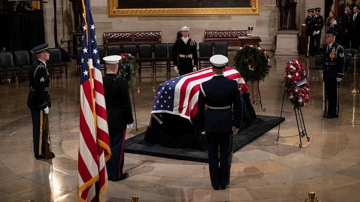 George H.W. Bush lies in state in Capitol Rotunda