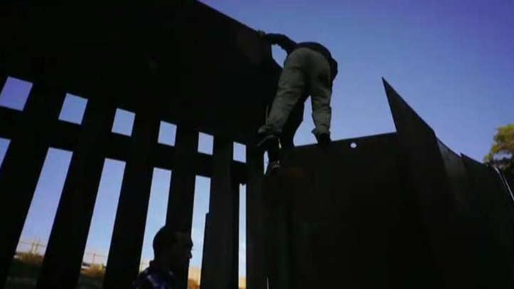 Several migrants breach US-Mexico border
